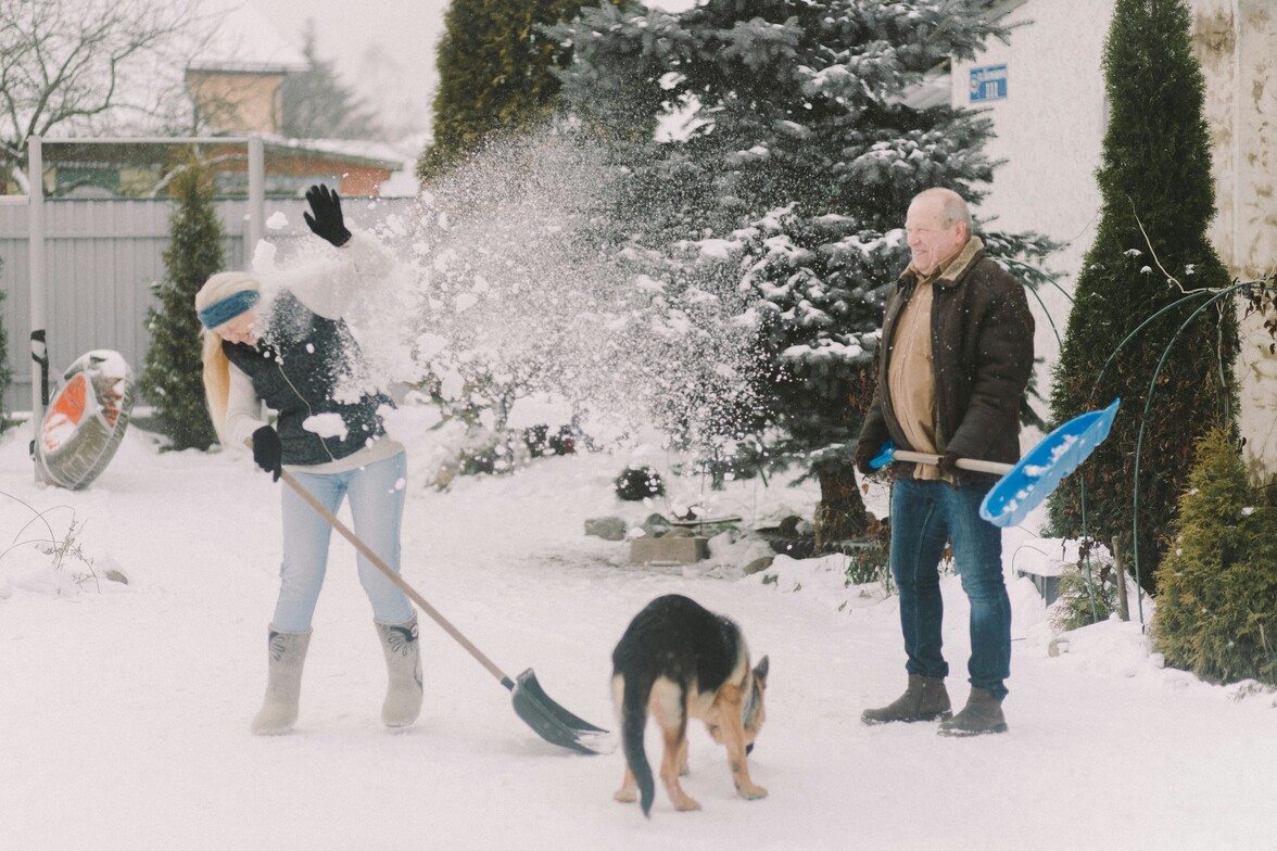 Older couple playing in the snow